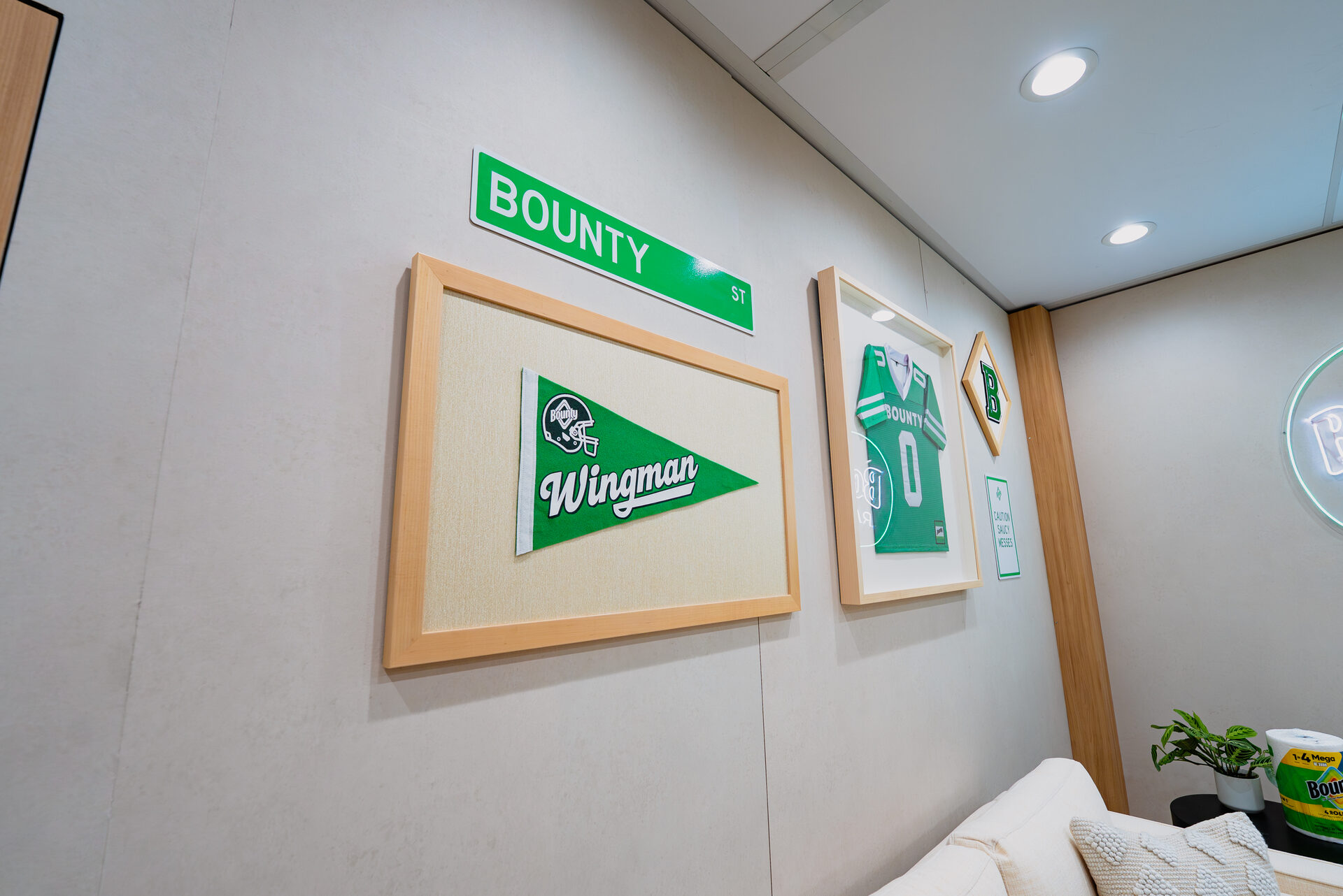 Bounty Wingman pennant and jersey wall detail inside Super Bowl LX activation