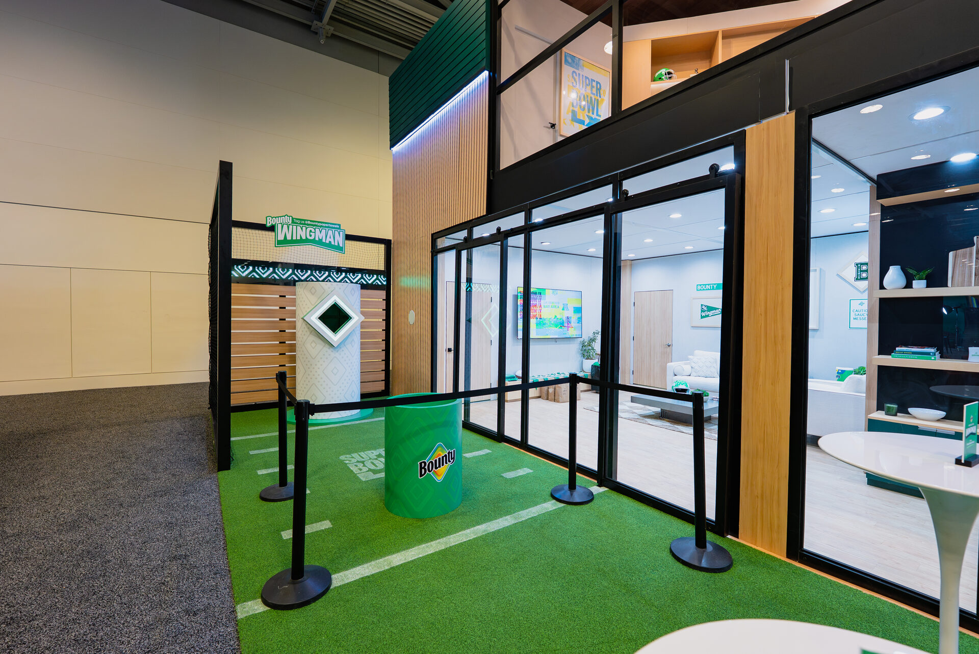 Field-turf forecourt and Wingman game station outside Bounty’s Super Bowl LX activation