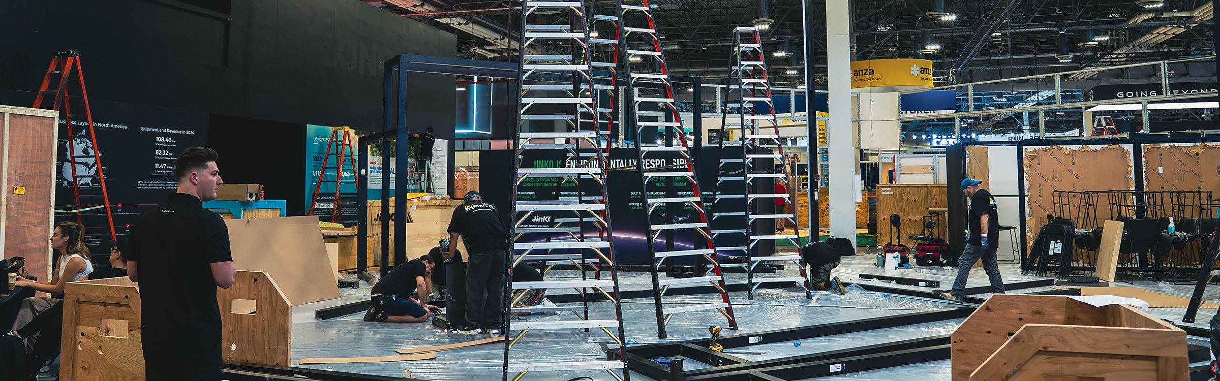 All Exhibit Solutions crew building the JinkoSolar booth at RE+ 2025