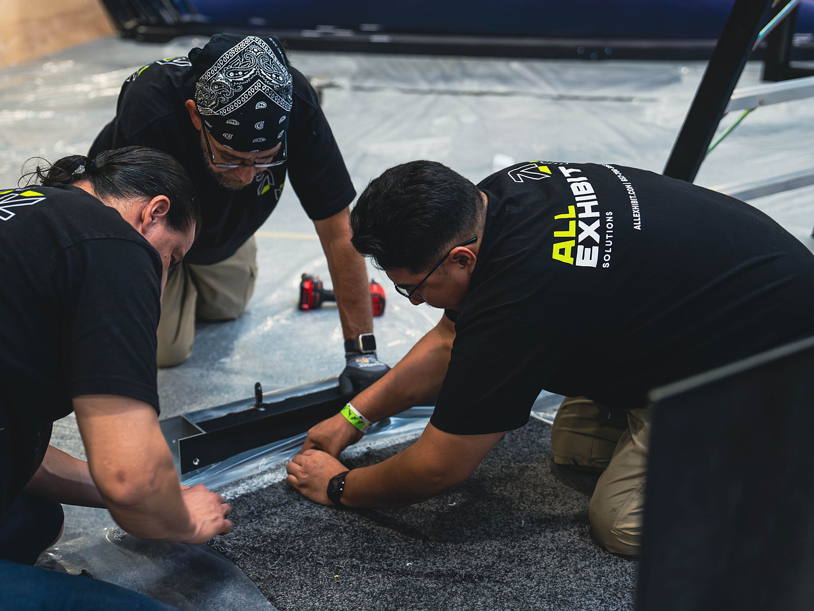 All Exhibit Solutions crew building a booth at RE+ 2025 in Las Vegas