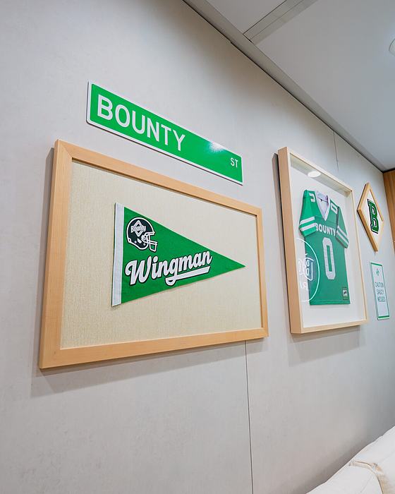 Framed Wingman pennants in the Bounty activation at Super Bowl LX