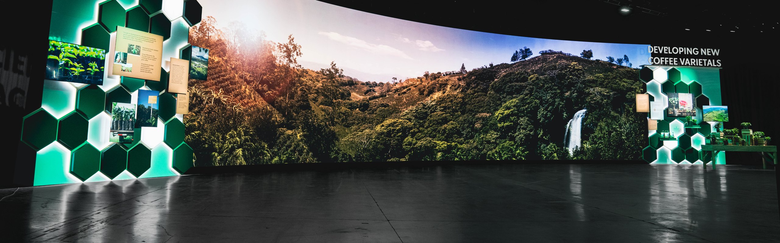 The curved Hacienda Alsacia LED wall lit in the darkened hall at the Starbucks leadership event in Las Vegas